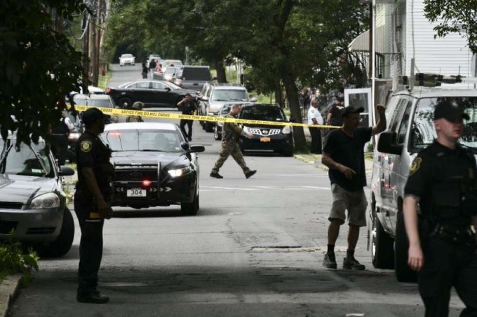 Albany police descended on the city's South End after a 3-year-old boy at a daycare center was hit in the arm by a stray bullet fire during a shootout between masked men who jumped out of a car and other men on a street.