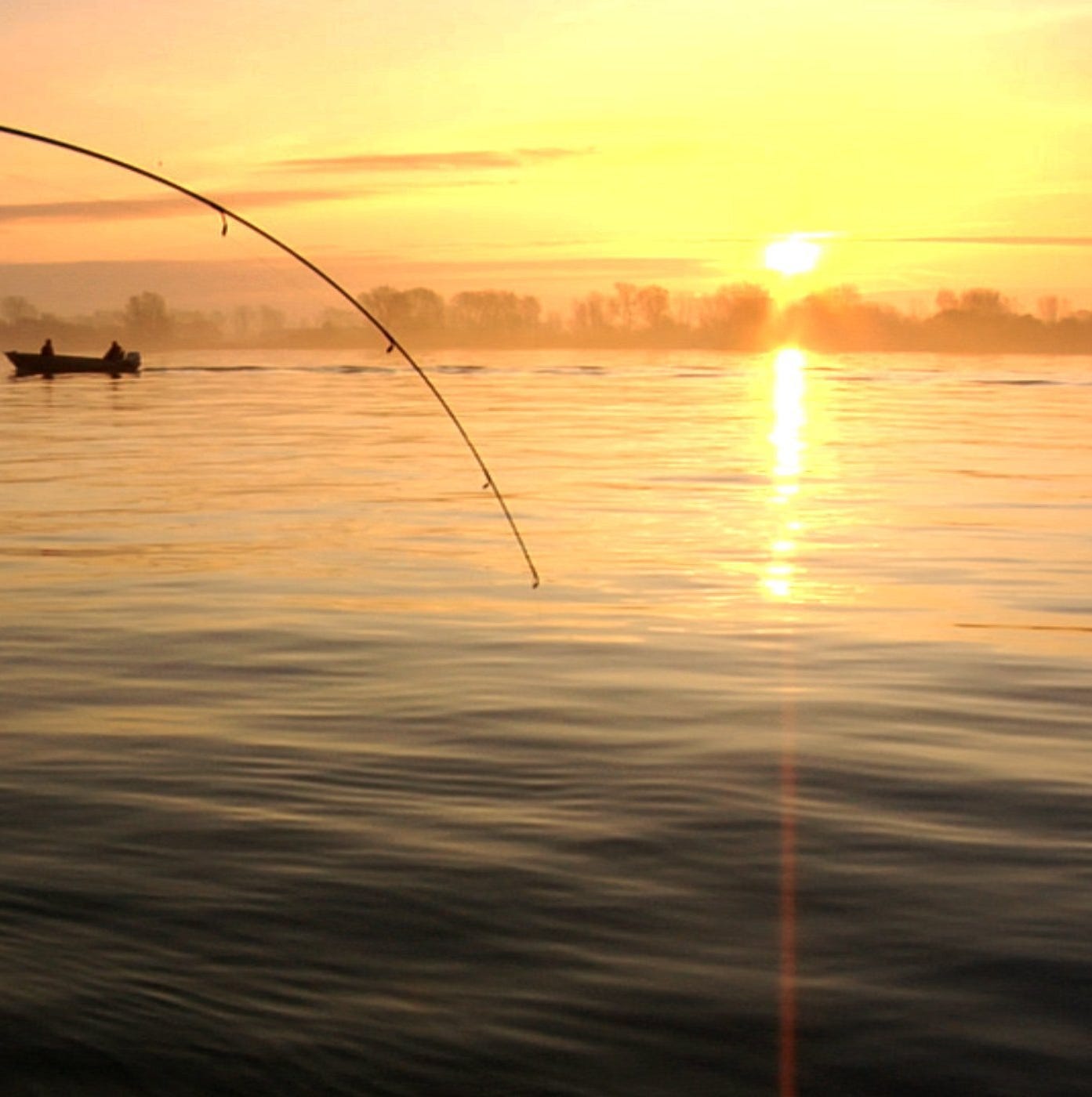 In this 2008 file photo, Captain Nick Hoyamed and his friend John Balogh are one of many boats and fishing lines dotting the Detroit River near Wyandotte fishing for walleyes.