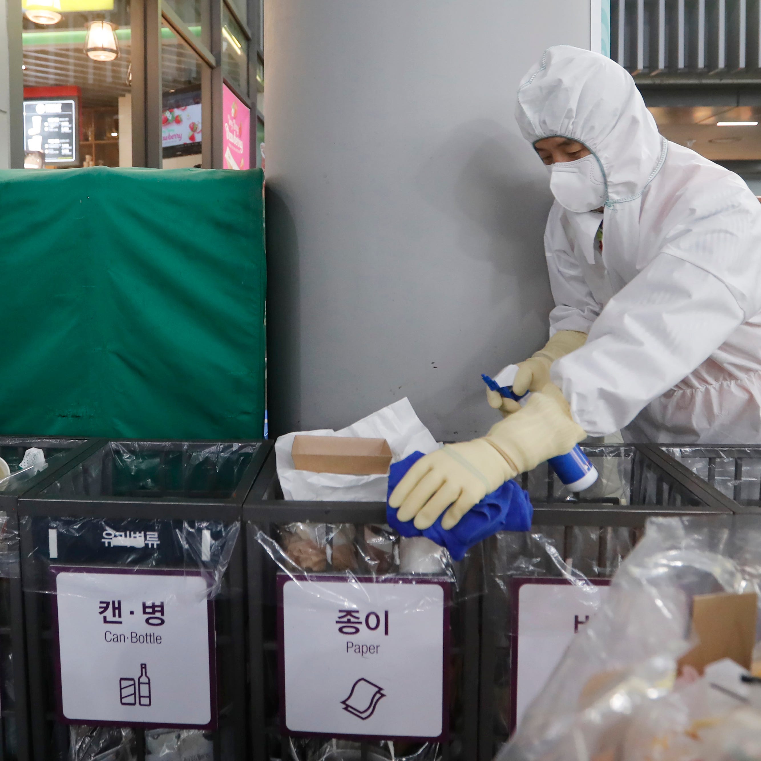 FILE - In this Jan. 24, 2020, file photo an employee works to prevent a new coronavirus at Suseo Station in Seoul, South Korea. On Friday, Jan. 24, 2020, The Associated Press reported on the false claim that the coronavirus outbreak spreading from China is nothing new and that patents were created around it years ago. The patents being shared online are not related to the new respiratory virus that has sickened hundreds of people in China and caused concern around the world. (AP Photo/Ahn Young-joon, File)