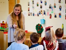 Ashley Dobrozsi-Ferguson with children in TIP Classroom B