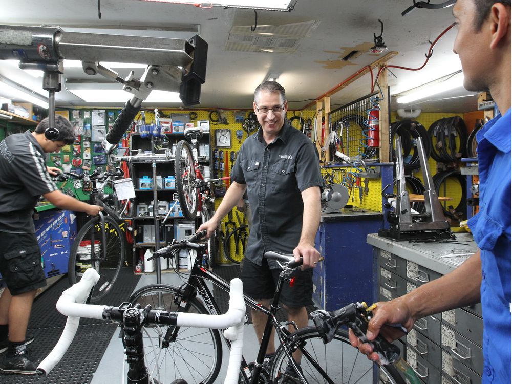 Cycle Robert's Pierre Poulet, centre, has seen a lot of novice mistakes, due in part to people buying off the rack in big-box stores because of challenges posed by physical distancing. “I’m getting people showing up with their Canadian Tire bike still in the box, or with a bike they bought from a neighbour that isn’t worth fixing,” says Poulet, pictured in 2013.