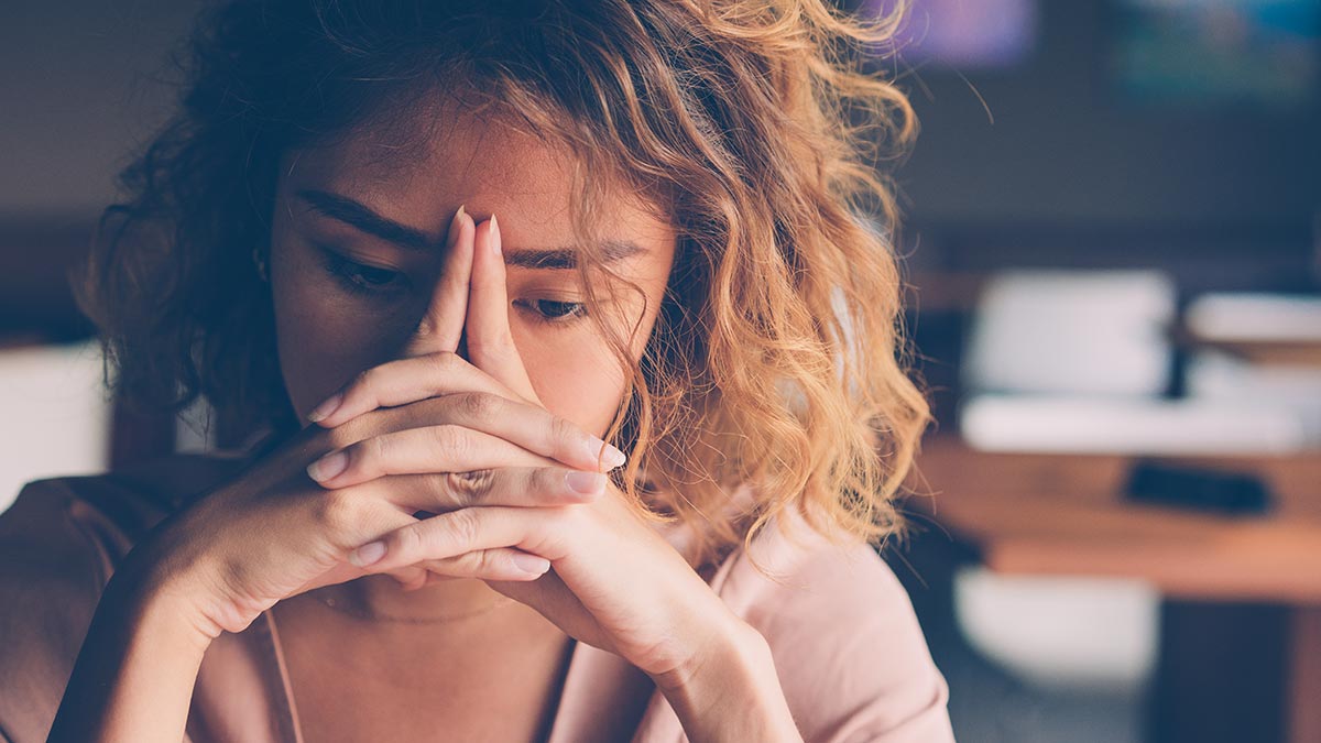 Young woman looks sad