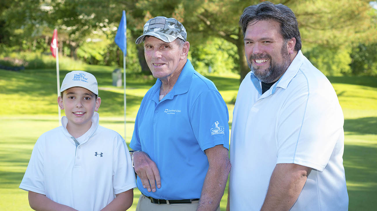 Vietnam veteran Charlie Morris golfs with his son and grandson at Challenge Golf. 