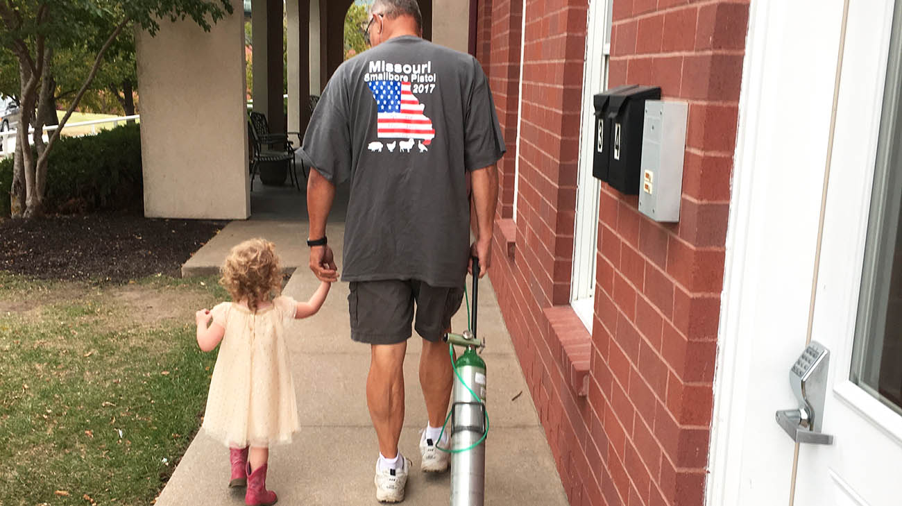 Lung transplant and triple bypass patient Ed Meyer with his granddaughter. 