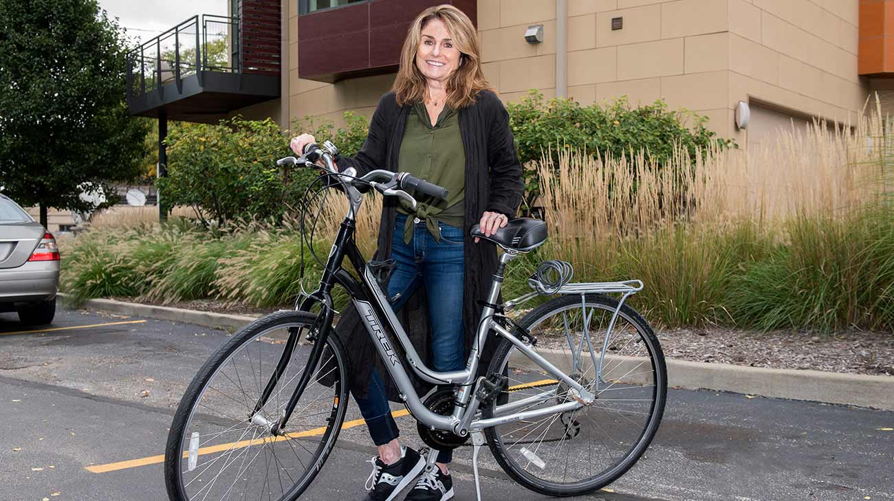 Stephanie riding her bike after recovering from surgery.