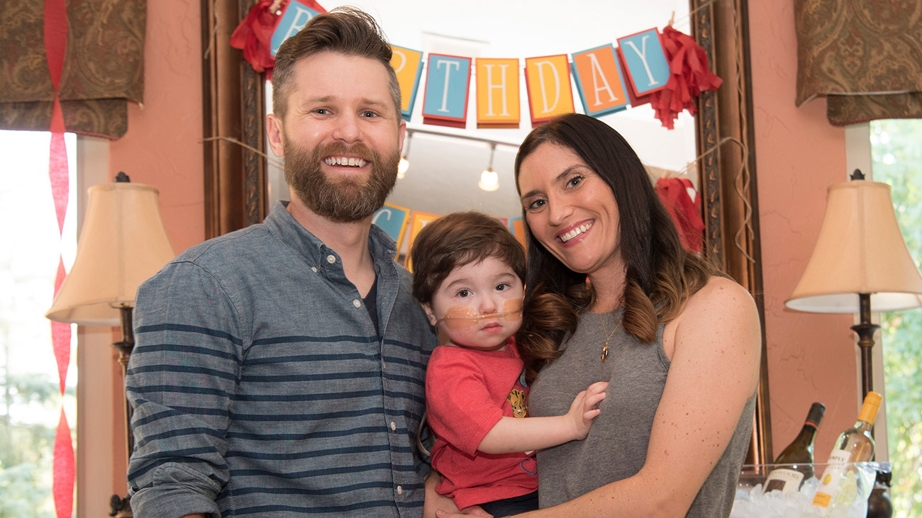 Crosby Gebura celebrating his 1st birthday with his parents.