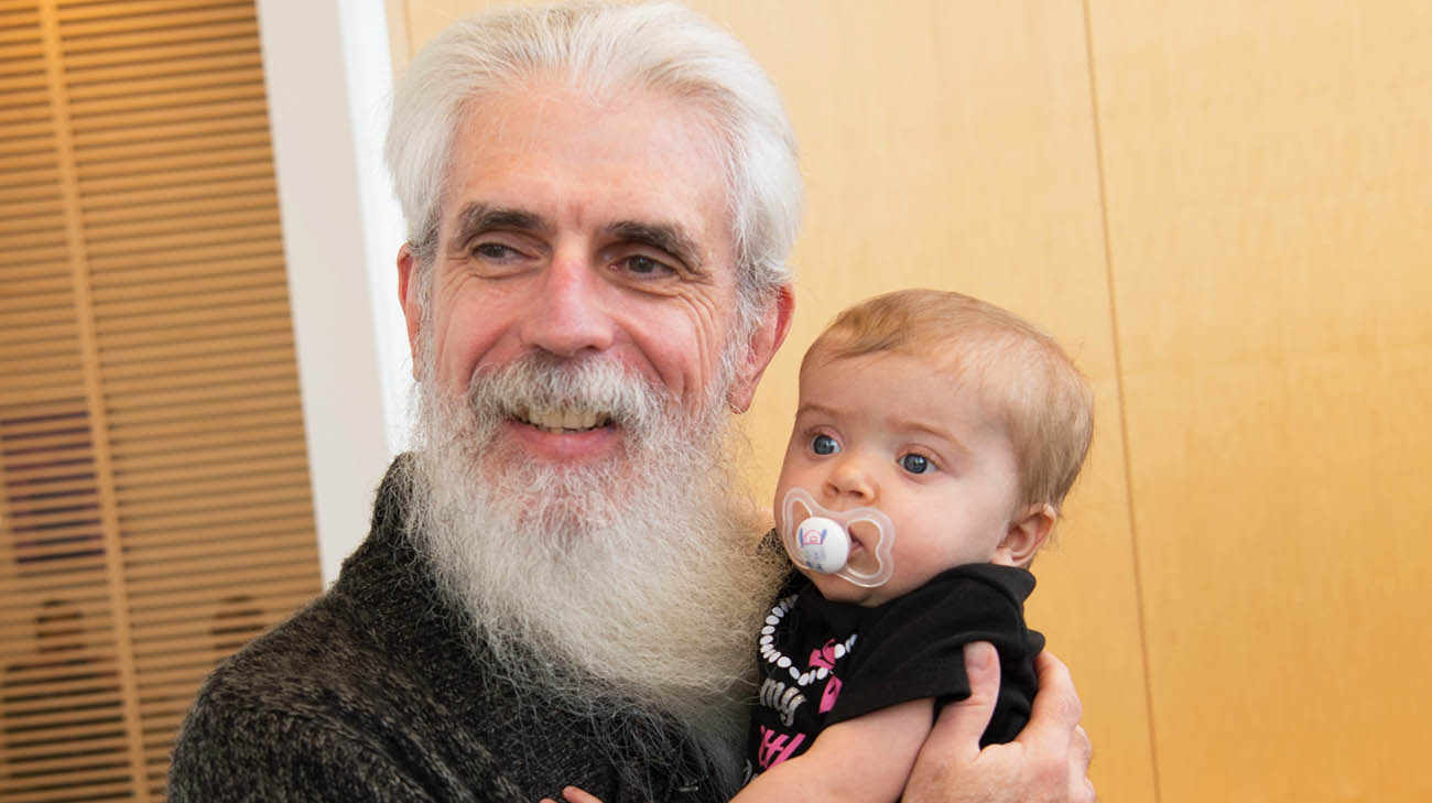 Joe Gilvary, two-time living organ donor, holds liver recipient, Katelyn Kutscher. 